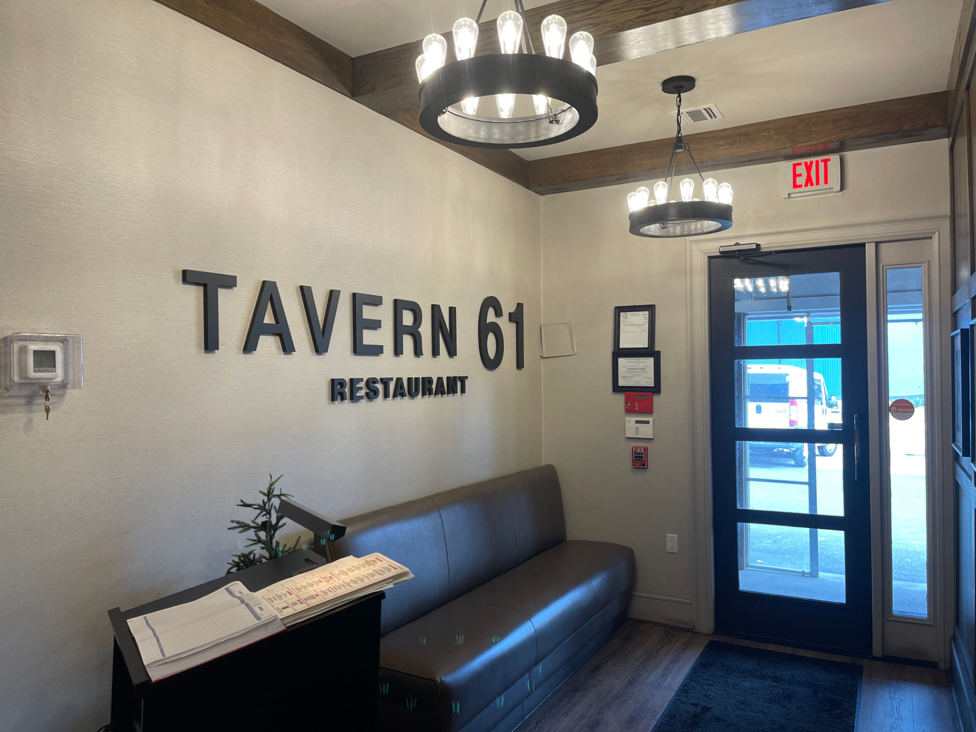Restaurant entry with painted walls, door surround, and ceiling trim