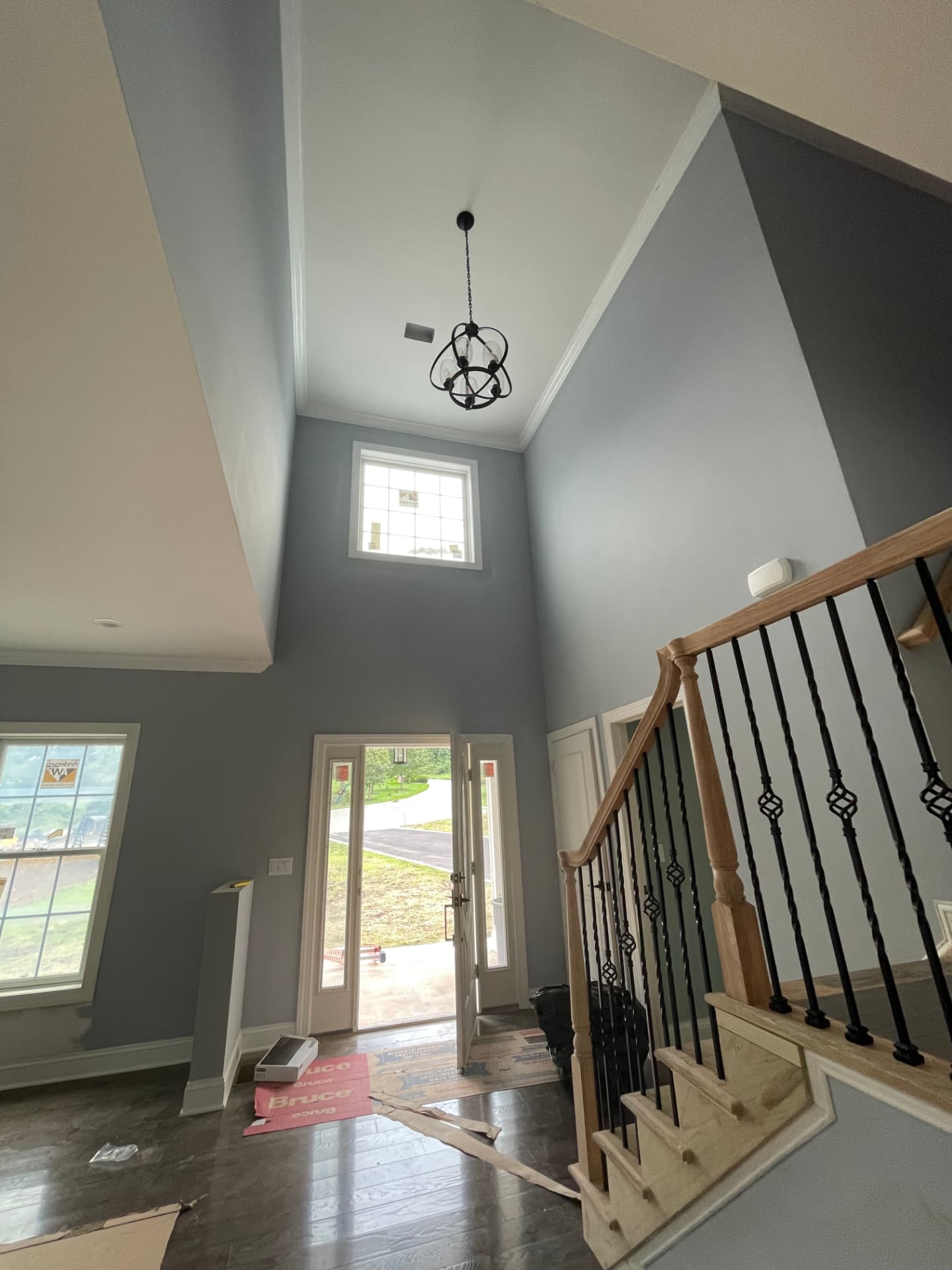 Painted two-story entryway and stair trim