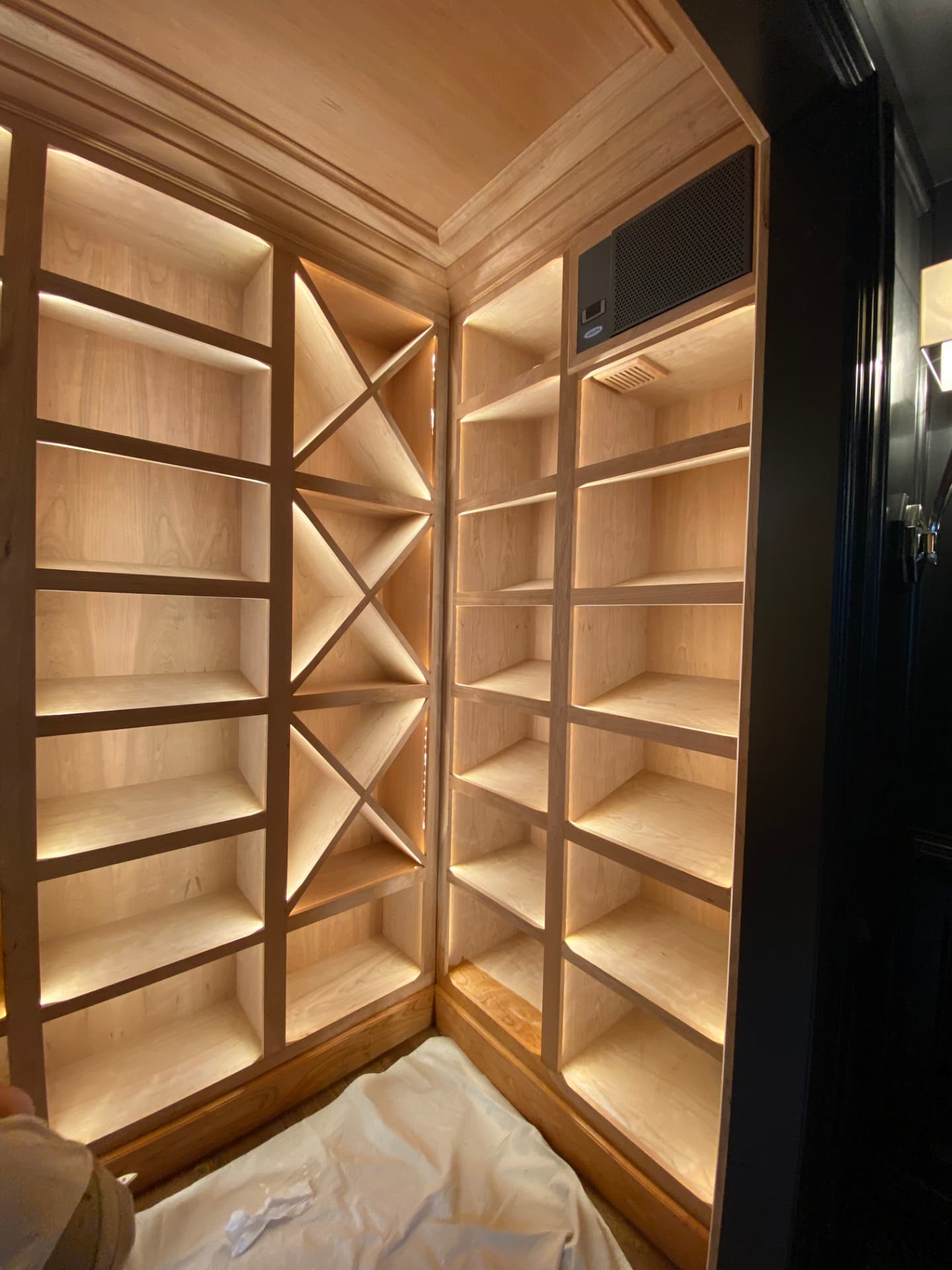 Custom wine shelving with concealed warm LED lighting